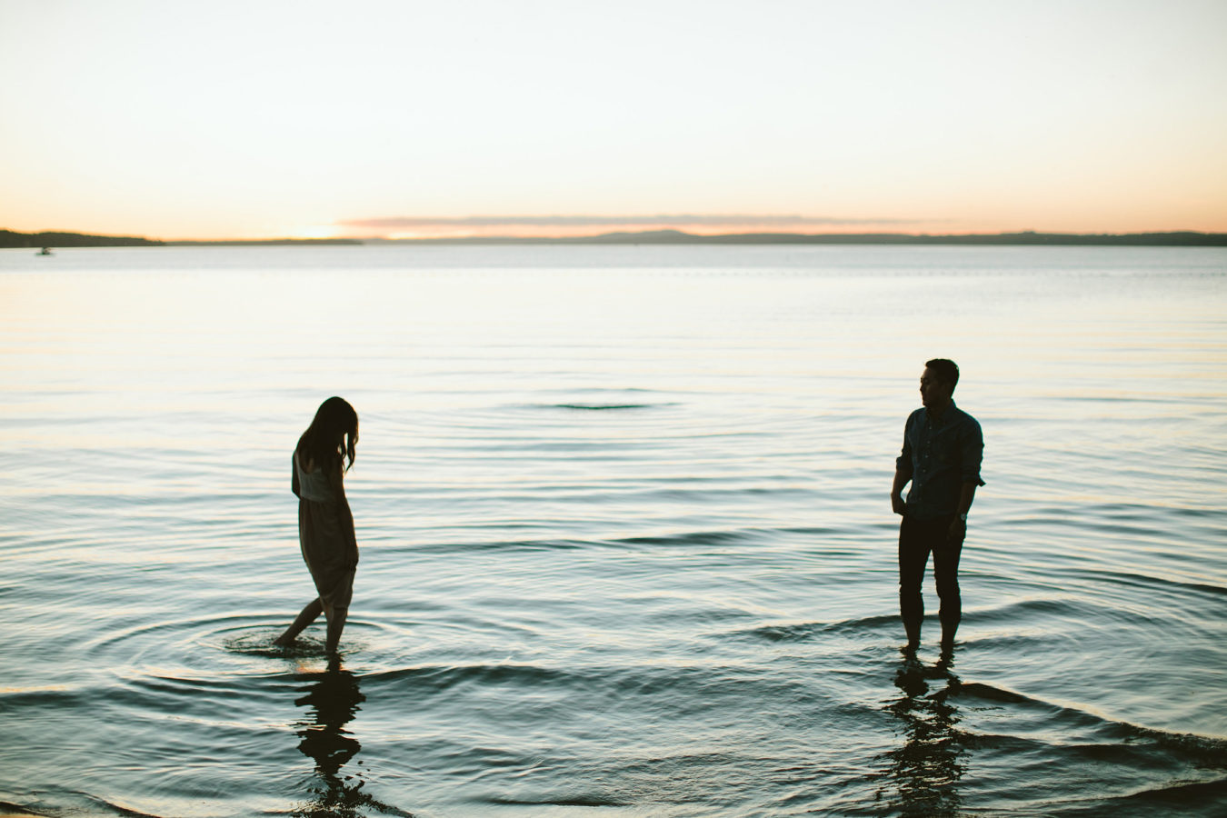 couple standing in the sylvan lake for their engagement session